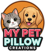 A circular cartoon logo featuring a gray-and-white cat and a golden retriever dog against an orange circle, with the text 'MY PET PILLOW CREATIONS' below in pink, aqua, and white lettering on a black background.